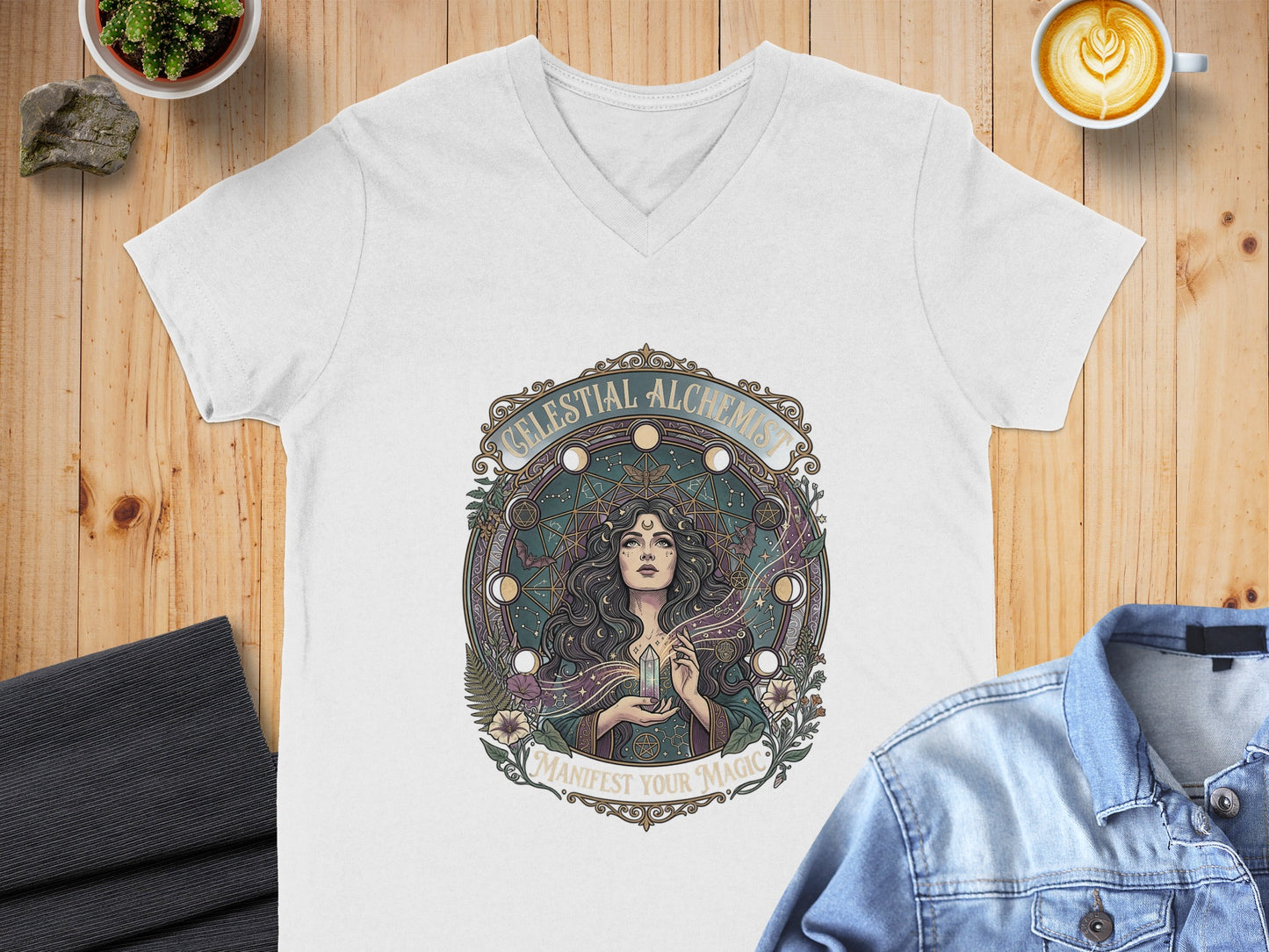 White t-shirt with "Celestial Alchemist" and crystal graphic.