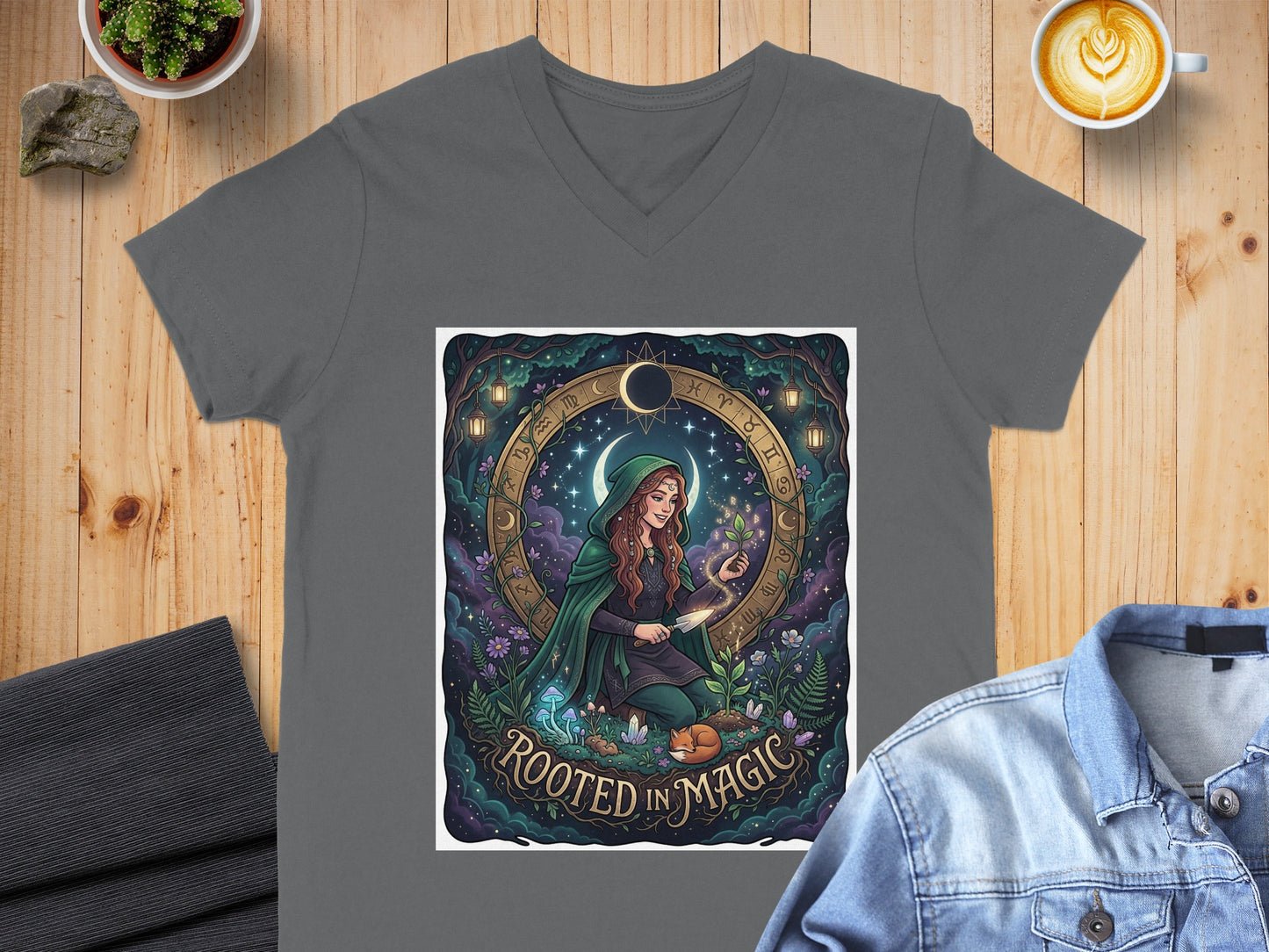 Woman in green cloak with plants, surrounded by zodiac symbols, "Rooted in Magic" text.