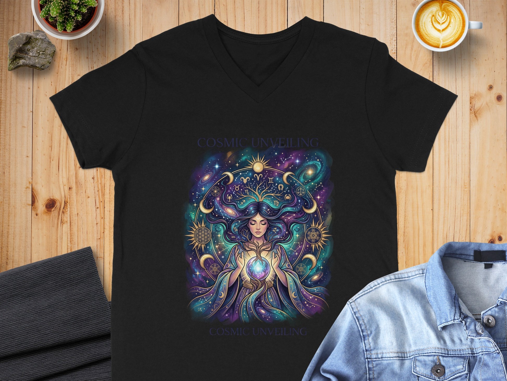 Black v-neck t-shirt featuring Cosmic Unveiling graphic with celestial woman.