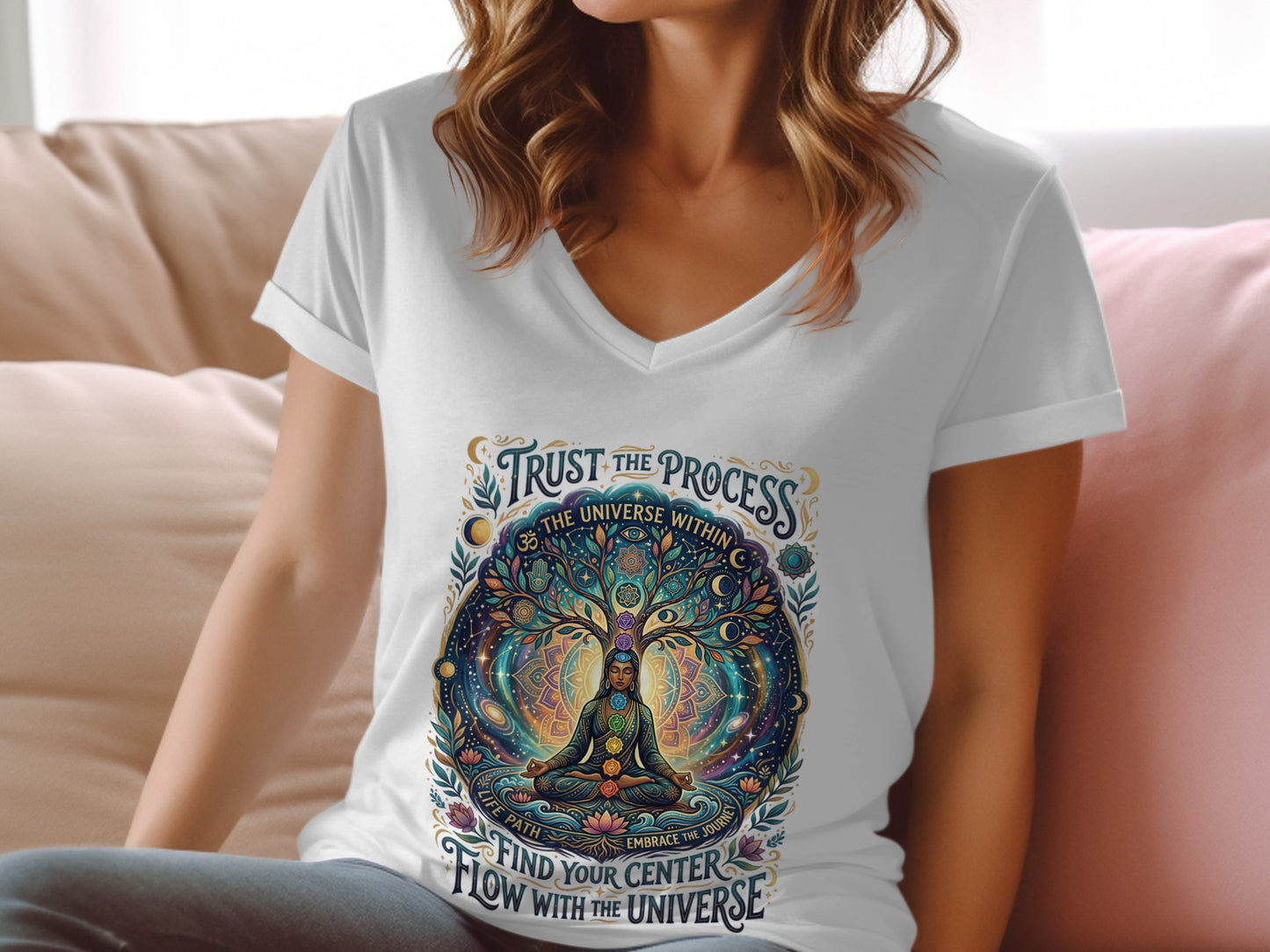 White v-neck t-shirt with colorful "Trust the Process" graphic featuring a meditating figure and cosmic tree.