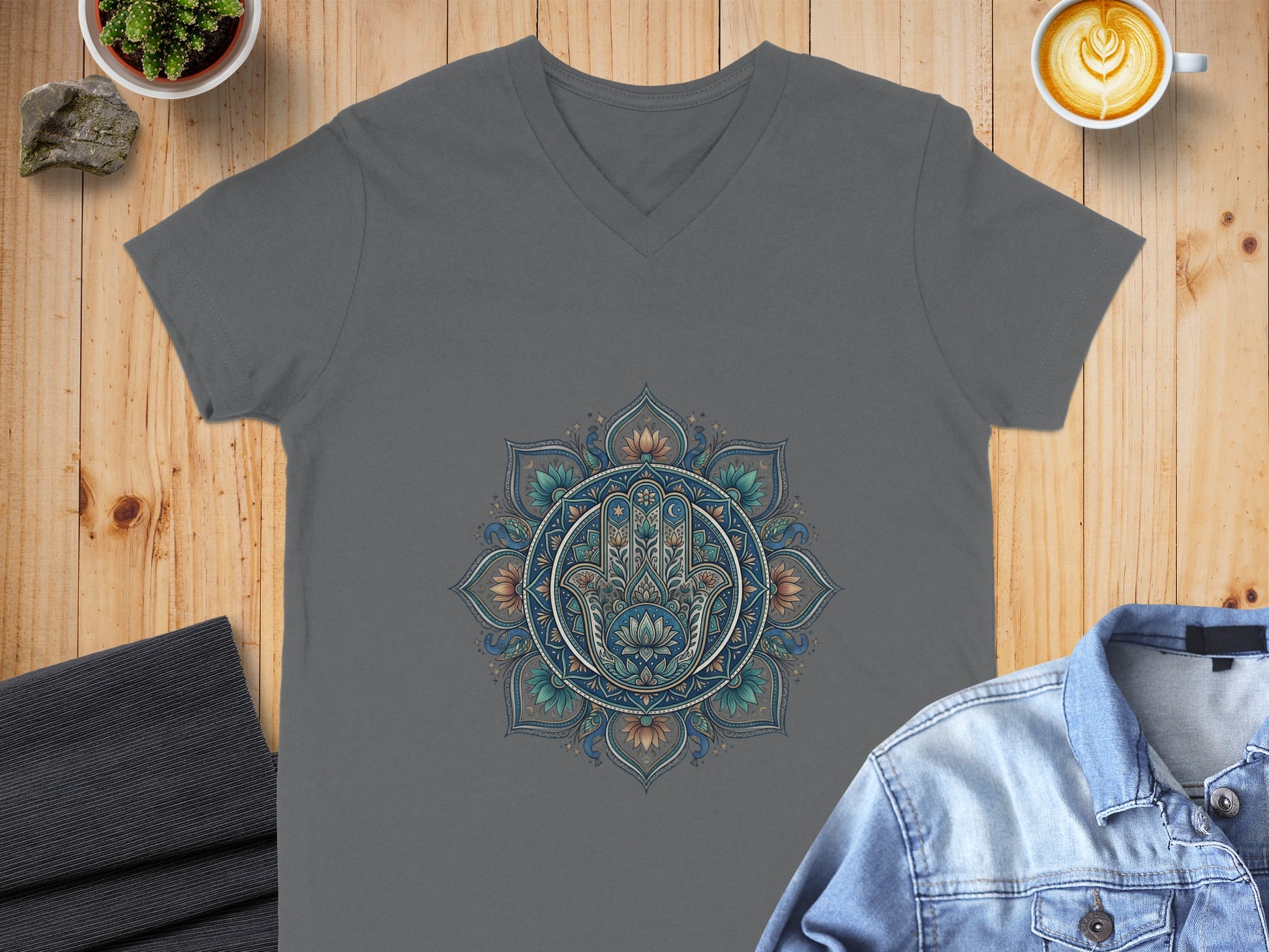 Grey V-neck t-shirt with a colorful mandala and hamsa hand design.
