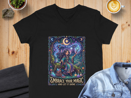 Black v-neck t-shirt with "EMBRACE YOUR MAGIC AND LET IT SHINE" text and mystical art.
