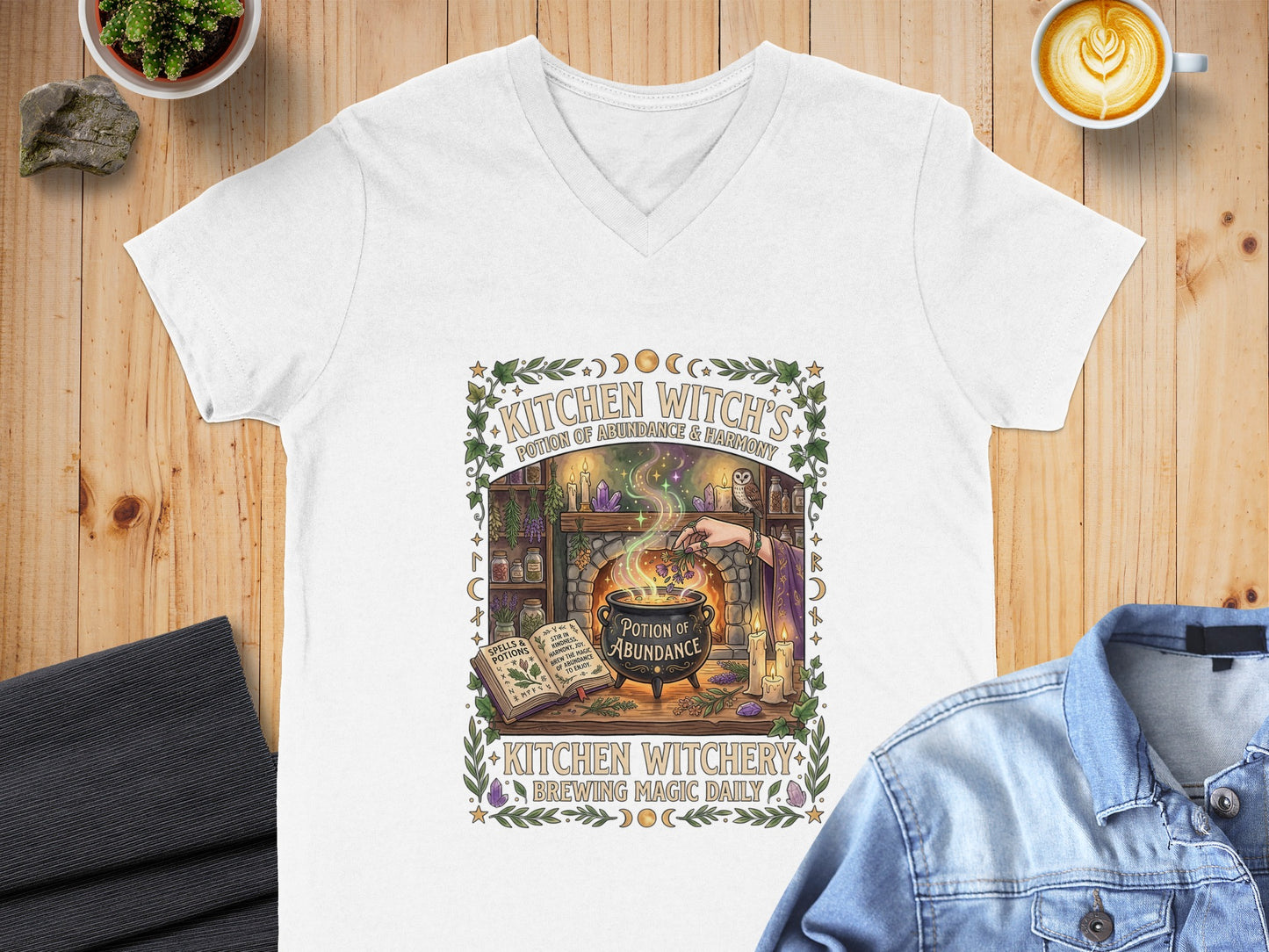 T-shirt with "Kitchen Witch's Potion of Abundance & Harmony" and witchy graphics.
