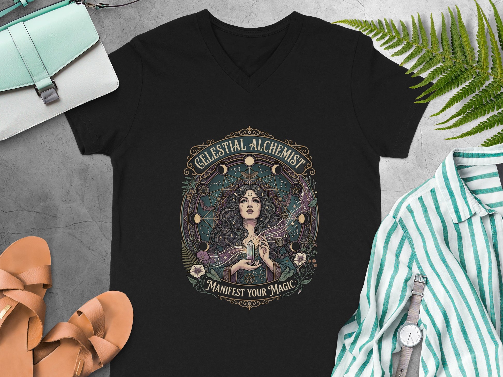 Black t-shirt with "Celestial Alchemist Manifest Your Magic" graphic.