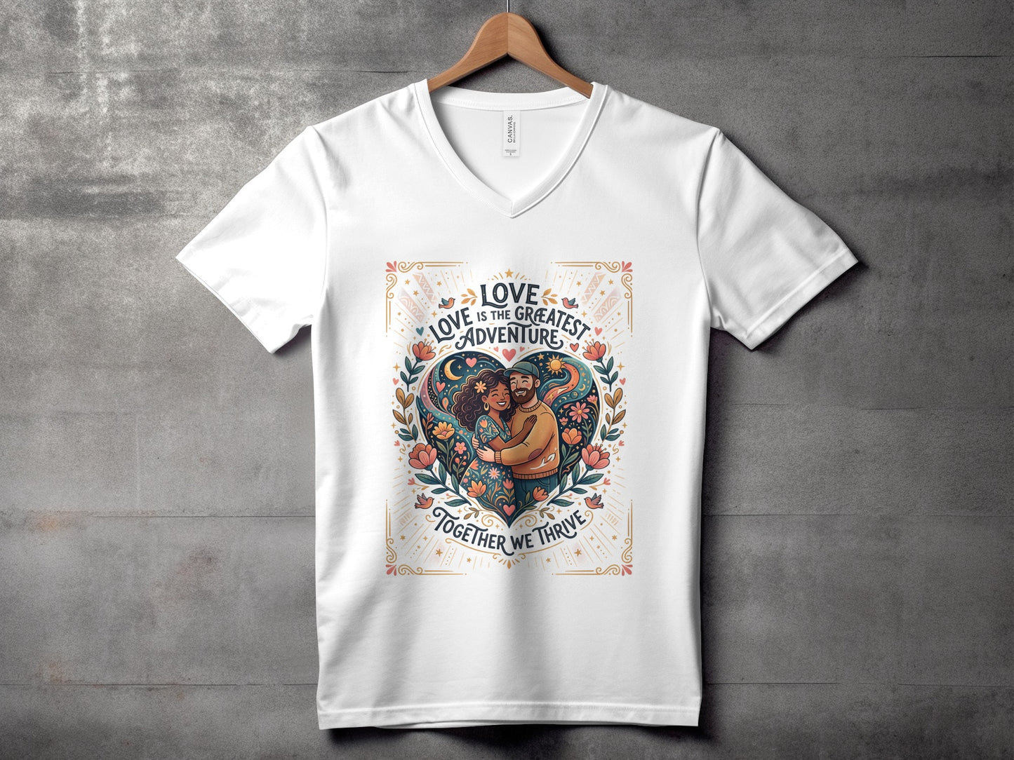White v-neck t-shirt with heart design and "Love is the greatest adventure" text.