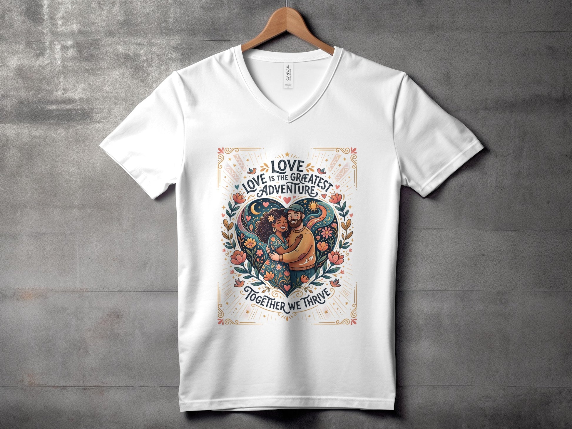 White v-neck t-shirt with heart design and "Love is the greatest adventure" text.