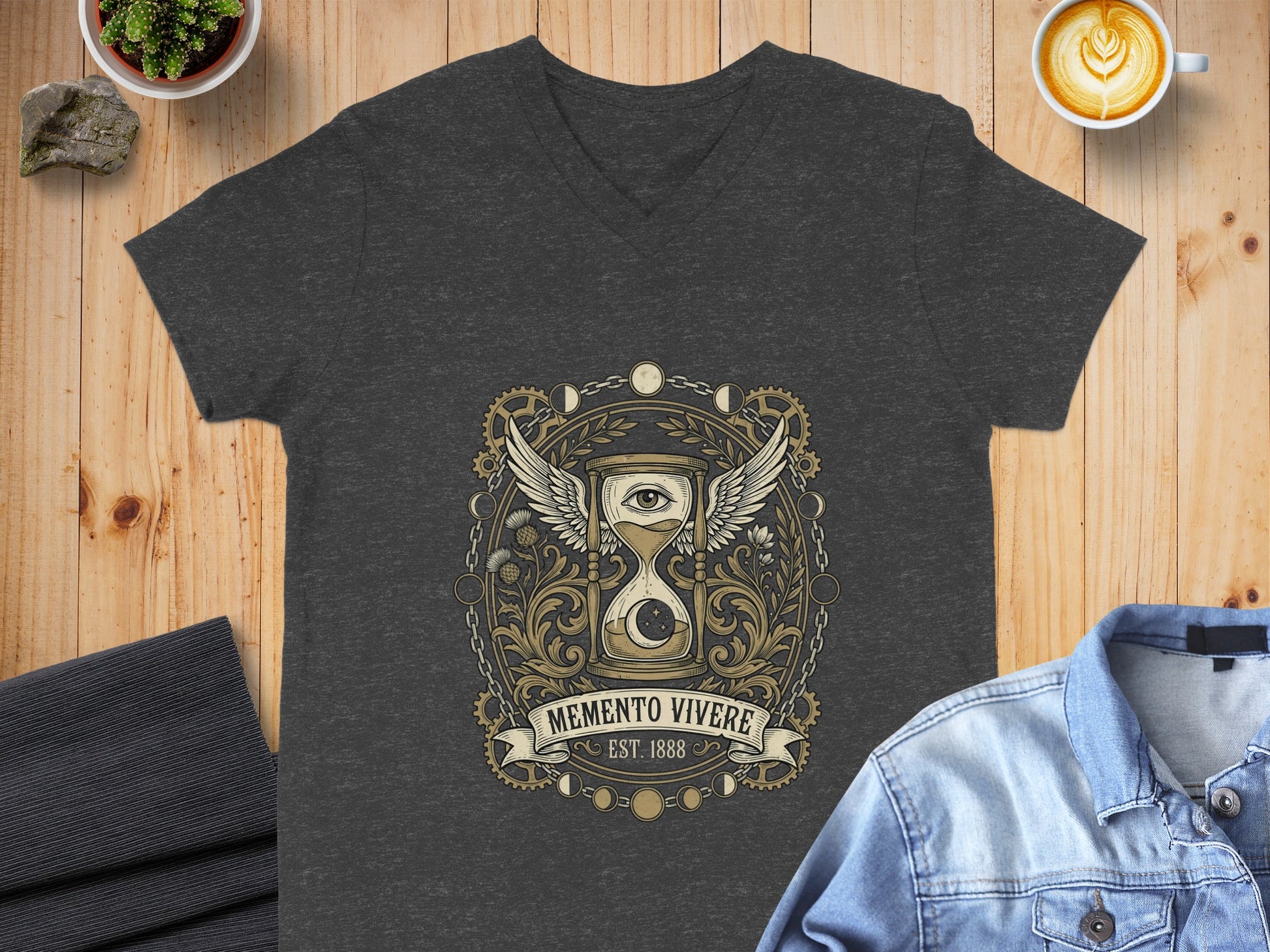 Dark grey v-neck t-shirt featuring a gold circular emblem with hourglass and wings.