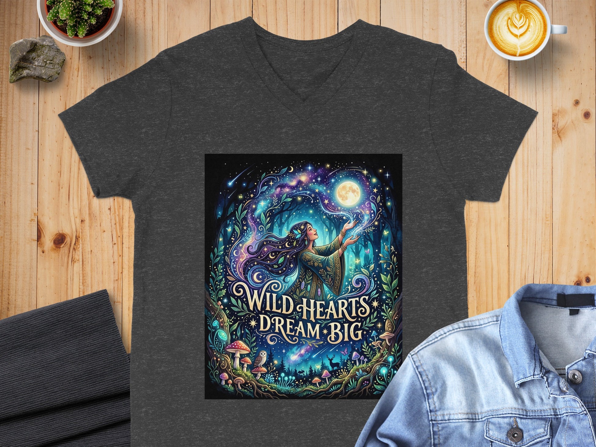 Dark t-shirt with graphic of woman reaching for moon in starry, mystical forest.