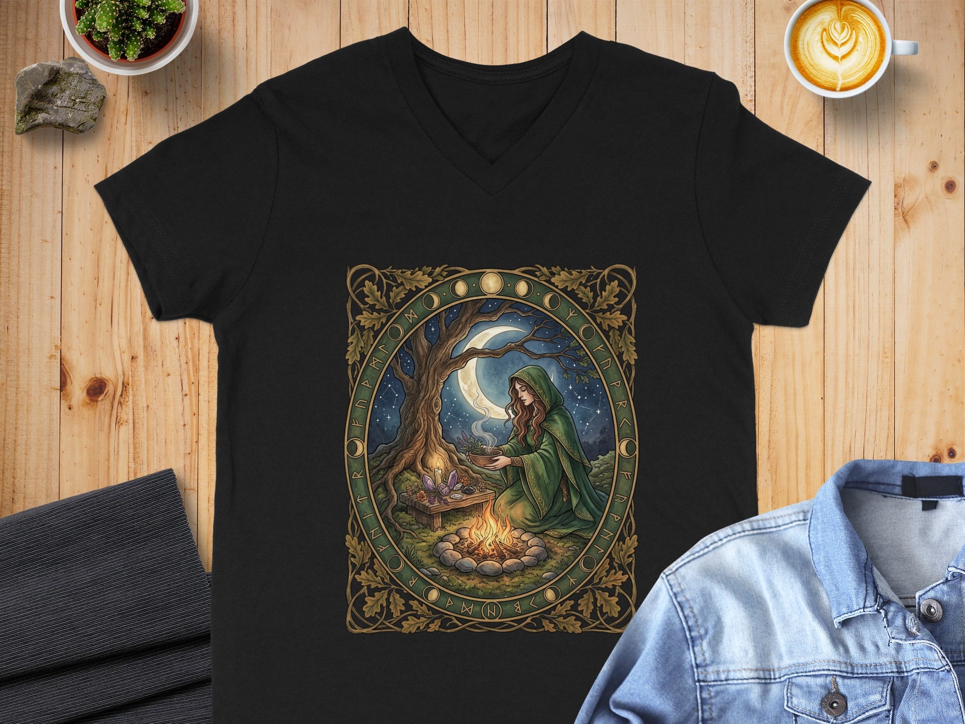 Black v-neck t-shirt with a Celtic-inspired moonlit witch and runes graphic.