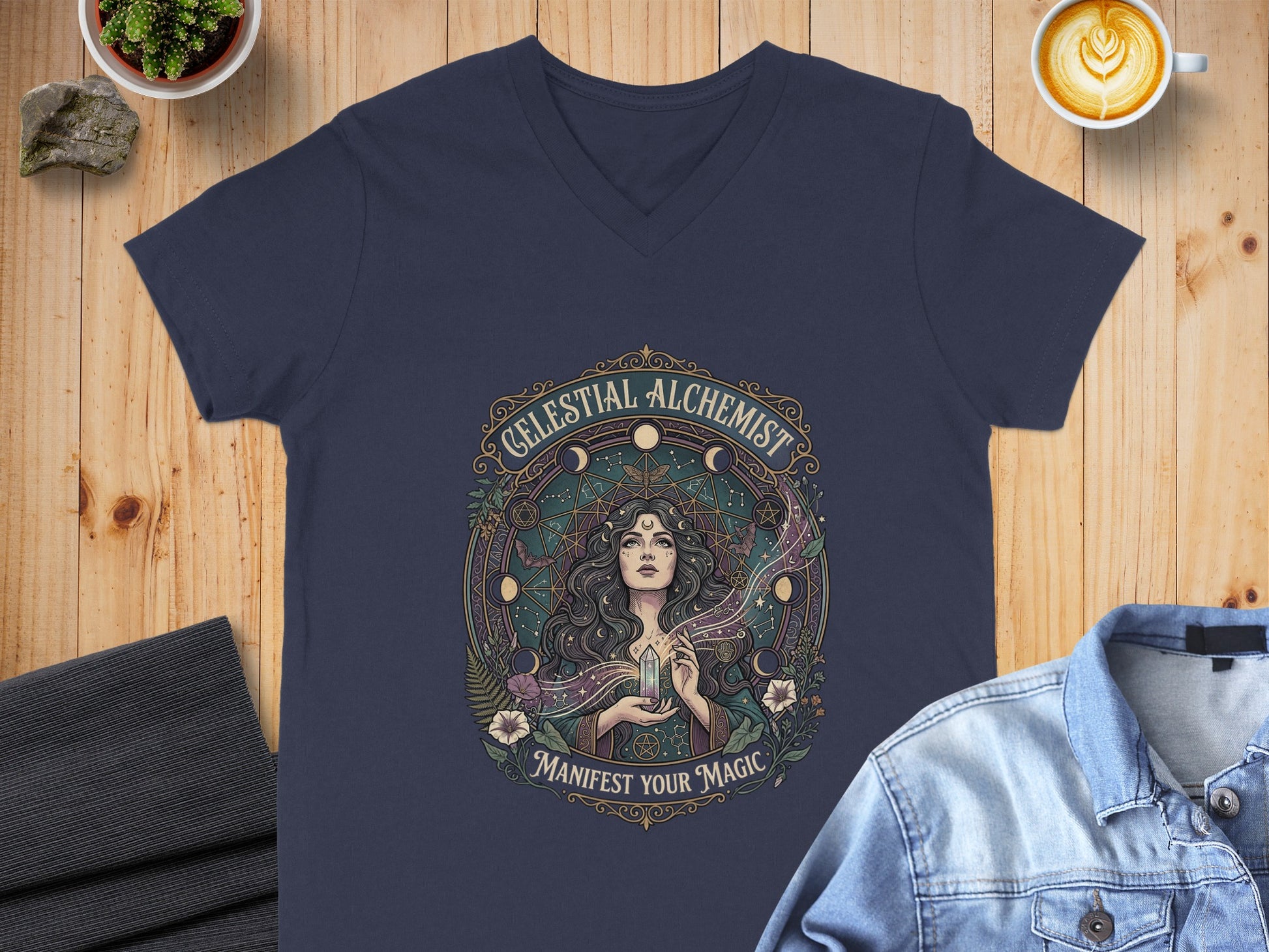 Navy v-neck t-shirt with "Celestial Alchemist Manifest Your Magic" graphic.