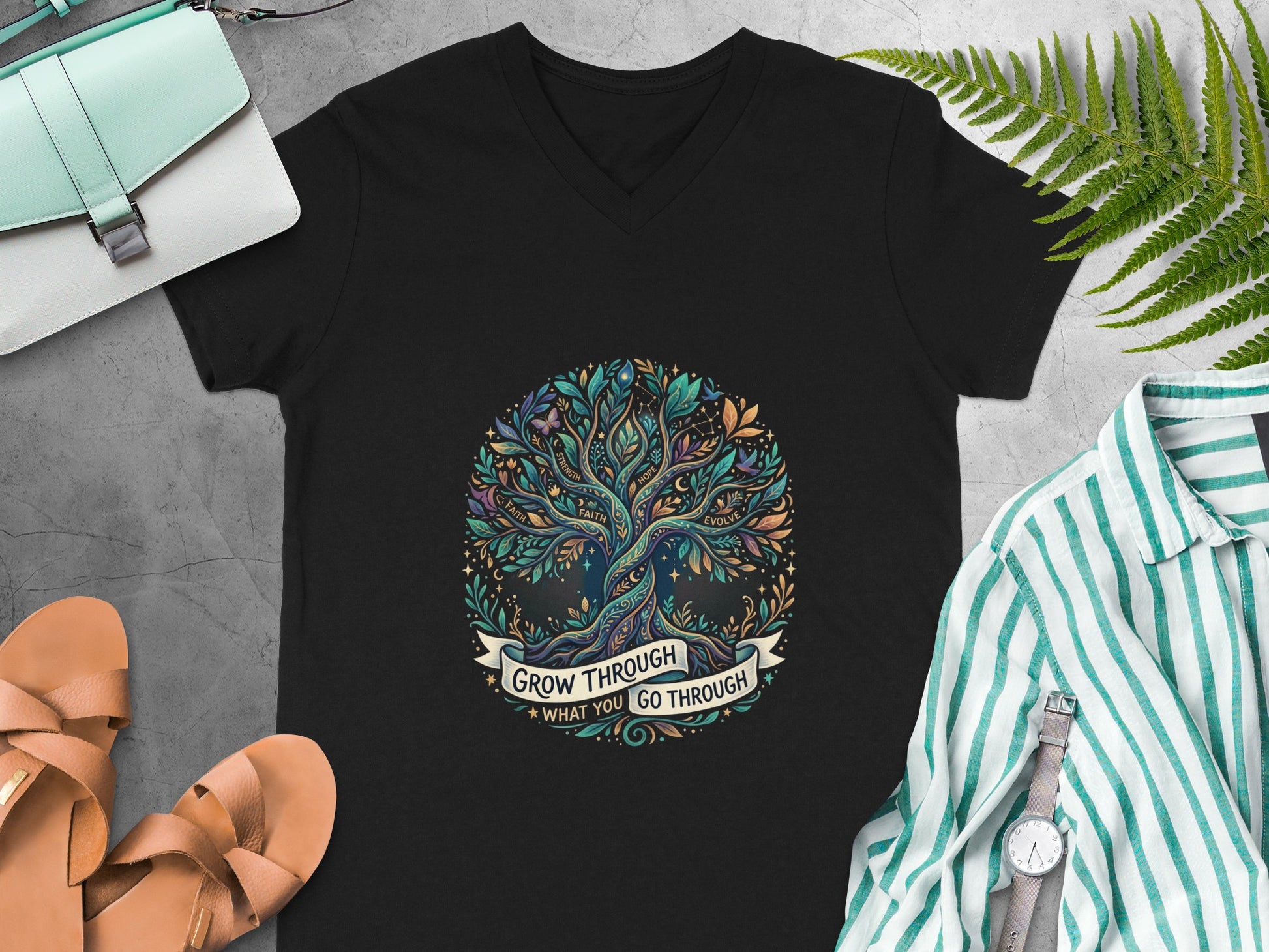 Black t-shirt with a colorful tree of life graphic and text "grow through what you go through."