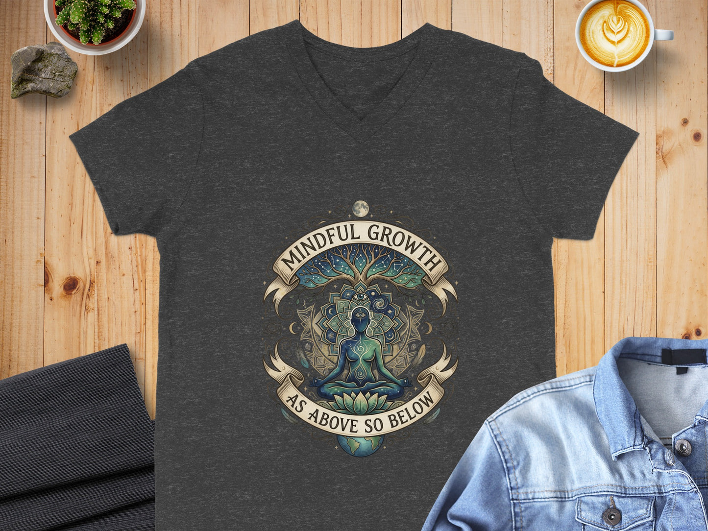 Dark t-shirt with a circular graphic of a meditating figure and "Mindful Growth As Above So Below".